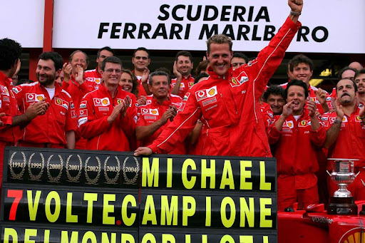 Michael Schumacher celebrates winning his seventh drivers' title with the Ferrari team.jpg